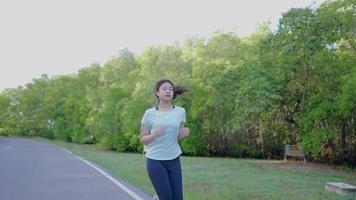 Asian girl jogging in the morning video