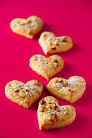 Heart shaped cookies for valentines day on pink background