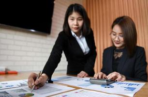 Asian female business team is working in the office.