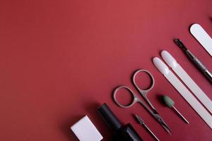 Manicure tools and tips on a colored background with copy space photo