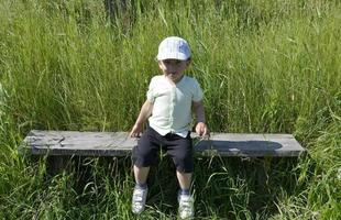 Beautiful baby boy with child face posing photographer photo