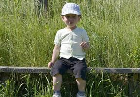 Beautiful baby boy with child face posing photographer photo