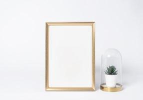 golden photo frame mock up and plants in vase Interior decor home elements.