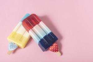 colorful an ice cream on pink pastel background. Summer minimal creative idea. photo