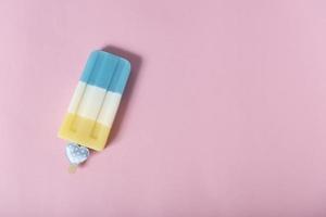 colorful an ice cream on pink pastel background. Summer minimal creative idea. photo