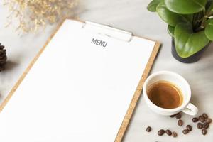 Menu paper mockup with coffee cup in restaurant for input design list text. photo