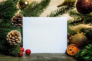 Christmas holiday greeting paper card design mockup with decoration on wood table. photo