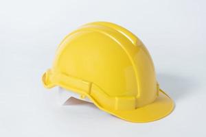Plastic safety helmet for engineer on gray background. photo