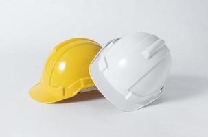 Plastic safety helmet for engineer on gray background. photo