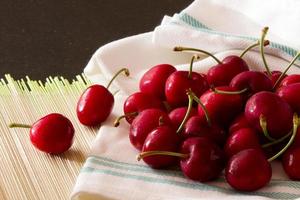 Fresh Cherries on wooden table photo