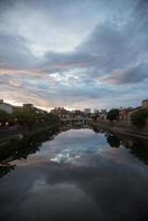 Beautiful view of Kanazawa along the river. Cloudy sky at sunset. Kanazawa, Japan photo