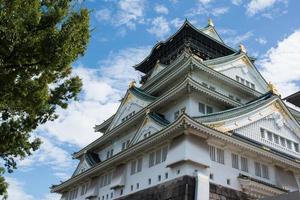 Close up of the facade of the Osaka castle. Blue sky with clouds. Osaka, Japan