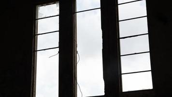 Broken window in an abandoned building photo
