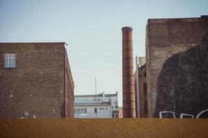 Old factory building with industrial brick chimney