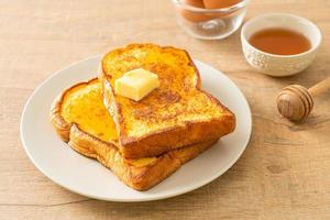 French toasted with butter and honey photo