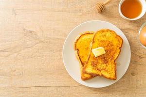 French toasted with butter and honey photo