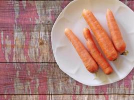 Carrots on wooden background video