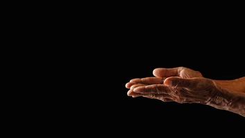 Wrinkled old man's hand photo