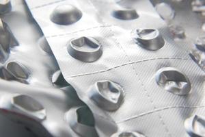 Close up of empty pills of blister pack on table photo