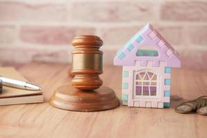 gavel , house and book with copy space on table photo