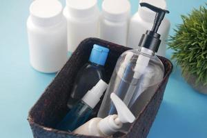 close up of many hand sanitizer in a box on table photo