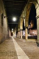 Ancient medieval gallery surrounding the main square of the city of Mantua photo