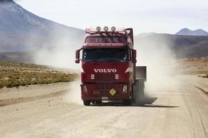 BOLIVIA, JANUARY 14, 2018 - Truck on the unpaved road in Bolivia. At 2004 more than 92 percent of roads in Bolivia were unpaved. photo