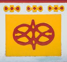 GUATAPE, COLOMBIA, SEPTEMBER 11, 2019 - Detail from colorful facade on the building in Guatape, Colombia. Each building in town Guatape has bright color tiles along the lower part of facade. photo