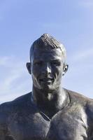 FUNCHAL, PORTUGAL, FEBRUARY 9, 2020, Christiano Ronaldo Statue in Funchal at Madeira Island, Portugal. Statue of famous Madeiran football player was created by sculptor Ricardo Velosa in 2014. photo