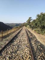 Abandoned railroad tracks through the mountains photo