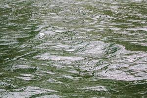 Green turquoise water with waves. Texture from above, Sognefjord Norway. photo