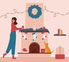 Cute girl decorating fireplace for Christmas eve. Living room interior with Christmas decorations socks, candles, gifts, garland, wreath, santa's hat, shelf and books. Funny cat trying to catch socks vector