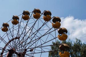 Abandoned metal radioactive attraction in an amusement park in the city of Pripyat photo