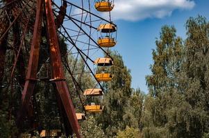 Abandoned metal radioactive attraction in an amusement park in the city of Pripyat photo
