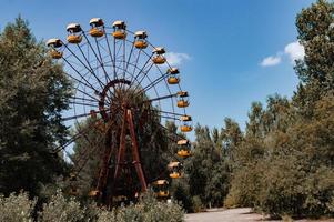 Abandoned metal radioactive attraction in an amusement park in the city of Pripyat photo