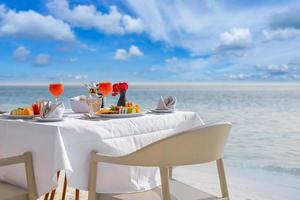 Luxury breakfast food on white table, with beautiful tropical sea view background, morning time summer holiday and romantic vacation concept, luxury travel and lifestyle
