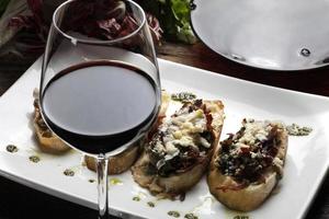 Bruschetta is an Italian antipasti made from bread, which is grilled with olive oil. photo