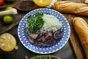 Traditional Brazilian feijoada with cabbage and rice photo