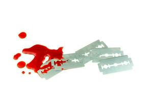 Photo of 5 Razor blade with a drop of blood on white background