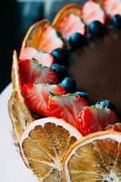 Selective focus chocolate cake with fruit photo