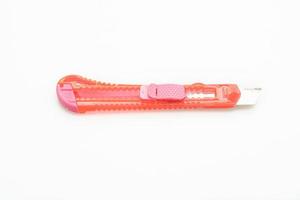 Pink Cutter Knife on white background photo