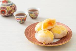 Chinese pastry moon cake with salted egg peanut or Spring Roll pastry with nuts and salted eggs photo