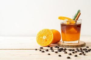 café negro con jugo de naranja y limón foto