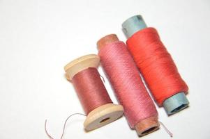 Spools of thread for sewing clothes close-up photo