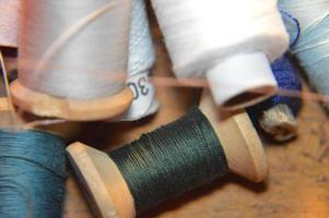 Spools of thread for sewing clothes close-up photo