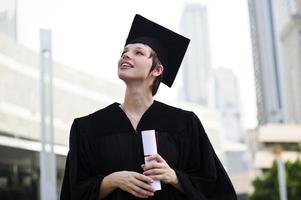 Happy woman portrait on her graduation day smiling photo