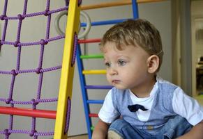 Beautiful baby boy with child face posing photographer photo