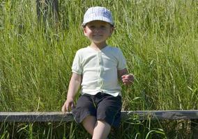 Beautiful baby boy with child face posing photographer photo