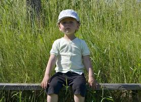 Beautiful baby boy with child face posing photographer photo