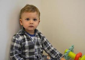 Beautiful baby boy with child face posing photographer photo